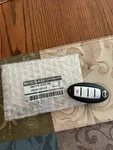 Genuine Nissan Keyless Entry Transmitter 28268-5EA1A. Fixed Price $75.00.